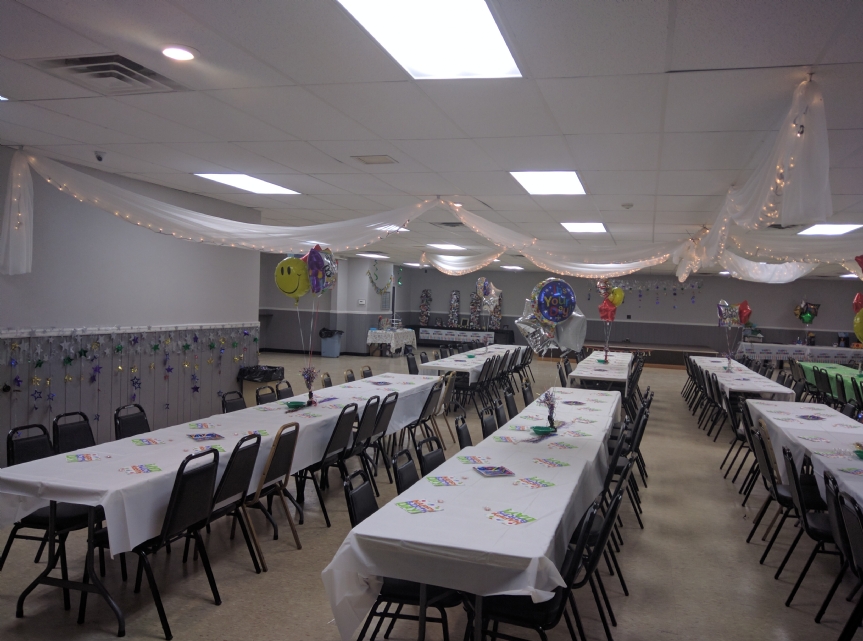 Another view of the hall decorated for an adult birthday party. 
